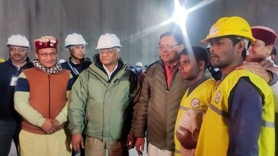 Uttarakhand CM Pushkar Singh Dhami meets the workers who were trapped inside the Silkyara tunnel after the rescue operation, in Uttarkashi on Tuesday. Union Minister VK Singh also seen. (ANI) Uttarakhand CM Pushkar Singh Dhami meets the workers who were trapped inside the Silkyara tunnel after the rescue operation, in Uttarkashi on Tuesday. Union Minister VK Singh also seen. (ANI)