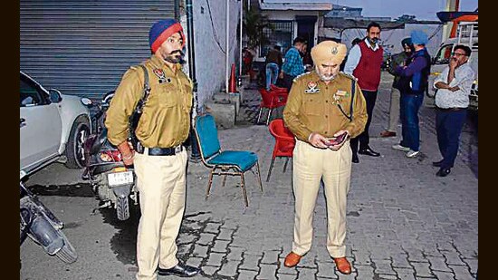 Cops at the spot where the two bike-borne men had targeted the filling station manager and his assistant, near Dholewal, in Ludhiana on Thursday. (Manish/HT)
