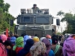 Residents from Meitei community stop an army vehicle from moving towards a gunfight site after a fresh clash between members of rival ethnic groups, in Imphal, Manipur, India, November 7, 2023.