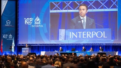 Interpol President Ahmed Naser Al-Raisi is seen on a screen as he addresses guests during the opening of the 91st INTERPOL General Assembly in Vienna, Austria, on November 28, 2023. (AFP) Interpol President Ahmed Naser Al-Raisi is seen on a screen as he addresses guests during the opening of the 91st INTERPOL General Assembly in Vienna, Austria, on November 28, 2023. (AFP)