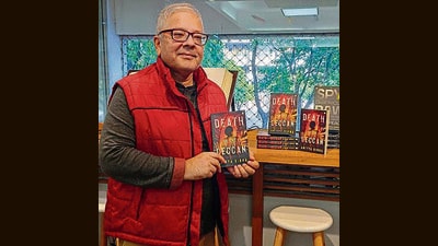 Author Aditya Sinha with his book, Death in the Deccan (HT Photo)