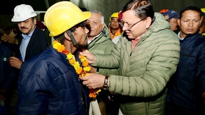 The rescued workers were draped in orange marigold flower garlands and were greeted by Uttarakhand Chief Minister Pushkar Singh Dhami and Union Minister VK Singh. (PTI) The rescued workers were draped in orange marigold flower garlands and were greeted by Uttarakhand Chief Minister Pushkar Singh Dhami and Union Minister VK Singh. (PTI)