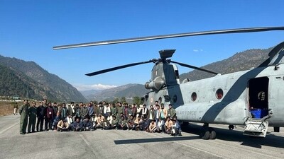 The 41 rescued workers from the collapsed Silkyara tunnel pose as they board the IAF's Chinook helicopter for Rishikesh for further medical examination on Wednesday. (ANI) The 41 rescued workers from the collapsed Silkyara tunnel pose as they board the IAF's Chinook helicopter for Rishikesh for further medical examination on Wednesday. (ANI)