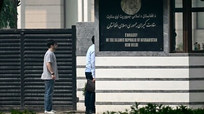 Visitors stand outside the Afghanistan embassy in New Delhi on November 24, 2023. (AFP) Visitors stand outside the Afghanistan embassy in New Delhi on November 24, 2023. (AFP)