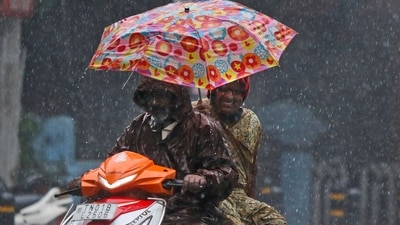 People drive amid gusty winds and heavy rain in Chennai, (AP) People drive amid gusty winds and heavy rain in Chennai, (AP)
