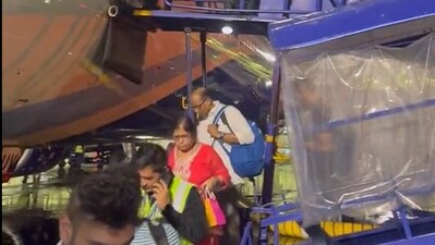Passengers getting out of an IndiGo flight following the announcing of delay in operations. (X/Kapil Sharma) Passengers getting out of an IndiGo flight following the announcing of delay in operations. (X/Kapil Sharma)