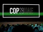 'COP28 UAE' logo is displayed on the screen during the opening ceremony of Abu Dhabi Sustainability Week (ADSW).