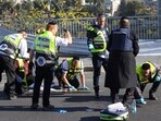 Iraeli rescuers inspect the scene of a shooting attack in Jerusalem 