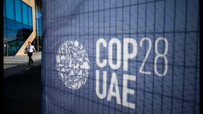 A man walks past a COP28 sign at the venue of the United Nations climate summit in Dubai on November 30, 2023. The UN climate conference opens in Dubai on November 30 with nations under pressure to increase the urgency of action on global warming and wean off fossil fuels, amid intense scrutiny of oil-rich hosts UAE. (AFP) A man walks past a COP28 sign at the venue of the United Nations climate summit in Dubai on November 30, 2023. The UN climate conference opens in Dubai on November 30 with nations under pressure to increase the urgency of action on global warming and wean off fossil fuels, amid intense scrutiny of oil-rich hosts UAE. (AFP)