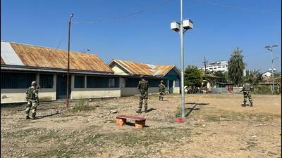 BSF personnel stand guard outside a morgue at JNIMS in Imphal on Thursday. (HT Photo) BSF personnel stand guard outside a morgue at JNIMS in Imphal on Thursday. (HT Photo)