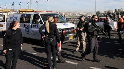 Israeli officials work at the scene of a violent incident in Jerusalem. (REUTERS)