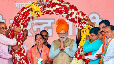 Prime Minister Narendra Modi with former Rajasthan chief minister Vasundhara Raje during a public meeting ahead of Rajasthan Assembly elections, at Anta in Baran district. (PTI) Prime Minister Narendra Modi with former Rajasthan chief minister Vasundhara Raje during a public meeting ahead of Rajasthan Assembly elections, at Anta in Baran district. (PTI)