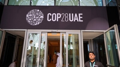 People walk past a COP28 sign at the venue of the United Nations climate summit in Dubai (AFP) People walk past a COP28 sign at the venue of the United Nations climate summit in Dubai (AFP)