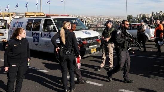 Israeli officials work at the scene of a violent incident in Jerusalem.(REUTERS)