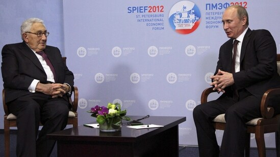 Russia's President Vladimir Putin speaks with former US Secretary of State Henry Kissinger during the St. Petersburg International Economic Forum in St. Petersburg in 2012.(REUTERS)