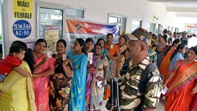Women voters show their ID cards as they stand in a queue to cast their votes for the Telangana Assembly elections, in Hyderabad on Thursday. Women voters show their ID cards as they stand in a queue to cast their votes for the Telangana Assembly elections, in Hyderabad on Thursday.