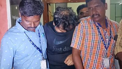 ED officer Ankit Tiwari taken from the DVAC office to be produced before a judicial magistrate in Dindigul, on Friday. He was caught red-handed while accepting a bribe of ₹20 lakhs from a doctor in Dindigul. (ANI) ED officer Ankit Tiwari taken from the DVAC office to be produced before a judicial magistrate in Dindigul, on Friday. He was caught red-handed while accepting a bribe of ₹20 lakhs from a doctor in Dindigul. (ANI)