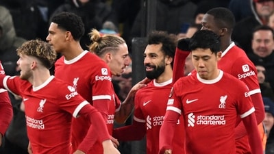 Liverpool's Egyptian striker #11 Mohamed Salah (C) celebrates with teammates after scoring their third goal during the UEFA Europa League group E football match between Liverpool and Linzer ASK (AFP) Liverpool's Egyptian striker #11 Mohamed Salah (C) celebrates with teammates after scoring their third goal during the UEFA Europa League group E football match between Liverpool and Linzer ASK (AFP)