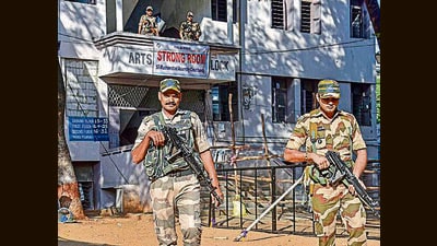 H Security personnel outside a strong room where EVMs are kept after the Telangana elections in Hyderabad on Friday. (PTI) H Security personnel outside a strong room where EVMs are kept after the Telangana elections in Hyderabad on Friday. (PTI)