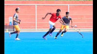 Players in action during the Ludhiana District Hockey Championship summit clash at the Punjab Agricultural University on Friday. Ludhiana District Hockey Championship reached its crescendo on Friday as Chachrari in Boys Under 14, Roomi in Under 17, and Jassowal in Under 19 emerged victorious, clinching the coveted trophies in fiercely contested final matches at the Punjab Agricultural University’s Hockey Stadium. (Manish/ HT)
