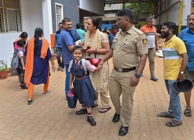 Bengaluru: Parents take their children home after 48 private schools received an email with a bomb threat on its premises. (PTI) Bengaluru: Parents take their children home after 48 private schools received an email with a bomb threat on its premises. (PTI)