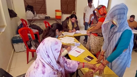 MP election results 2023: A voter gets her finger marked with indelible ink as she casts her vote for the Madhya Pradesh Assembly elections. MP election results 2023: A voter gets her finger marked with indelible ink as she casts her vote for the Madhya Pradesh Assembly elections.