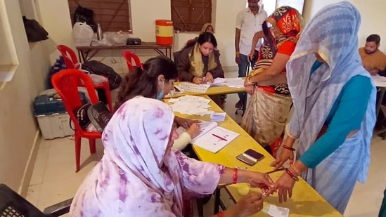 Voters wait in queues at a polling station to cast their votes for Telangana Assembly elections.(ANI)