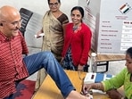 Indore, Nov 17 (ANI): Specially-abled voter Vikram Agnihotri casts his vote for the Madhya Pradesh Assembly elections, at a Polling Center in Indore on Friday. (ANI Photo)(CEOMPElections-X)