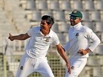 Bangladeshi cricketer Taijul Islam, left, and Mehidy Hasan Miraz celebrate the dismissal of New Zealand's Tom Blundell during the fourth day of the first test cricket match at Sylhet