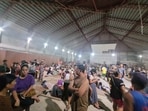 People gather at an evacuation center, in the aftermath of an earthquake, in Hinatuan, Surigao del Sur, Philippines December 2, 2023. 