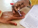 MP election results 2023: A polling official puts a mark with indelible ink on the finger of a voter prior to casting her vote at a polling booth for the Madhya Pradesh Assembly elections.(ANI)