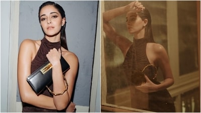 Ananya wore the outfit with matching brown-coloured stockings adorned in sequinned embroidery. She accessorised the mini dress with minimal additions, including ankle-length heeled pointed boots, a black rectangle-shaped mini top handle clutch, dainty ear studs, and statement rings. (Instagram) Ananya wore the outfit with matching brown-coloured stockings adorned in sequinned embroidery. She accessorised the mini dress with minimal additions, including ankle-length heeled pointed boots, a black rectangle-shaped mini top handle clutch, dainty ear studs, and statement rings. (Instagram)