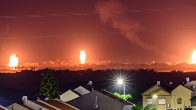 This long exposure picture taken from southern Israel near the border with the Gaza Strip shows explosions in the Palestinian territory during Israeli strikes as battles resumed between Israel and Hamas militants on December 2, 2023. (AFP)