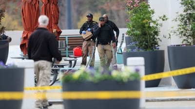 Emergency personnel work the scene after a protester set themself on fire outside the Israeli consulate in Atlanta. (AP) Emergency personnel work the scene after a protester set themself on fire outside the Israeli consulate in Atlanta. (AP)