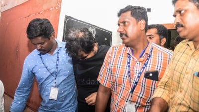 Enforcement Directorate officer Ankit Tiwari being arrested by the Directorate of Vigilance and Anti-Corruption (DVAC) officials, in Dindigul district, Friday, Dec. 1, 2023. (PTI) Enforcement Directorate officer Ankit Tiwari being arrested by the Directorate of Vigilance and Anti-Corruption (DVAC) officials, in Dindigul district, Friday, Dec. 1, 2023. (PTI)