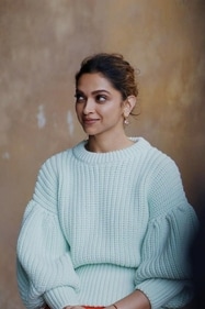 Deepika Padukone stuns in a blue pastel-coloured balloon sleeves sweater. (Pinterest) Deepika Padukone stuns in a blue pastel-coloured balloon sleeves sweater. (Pinterest)