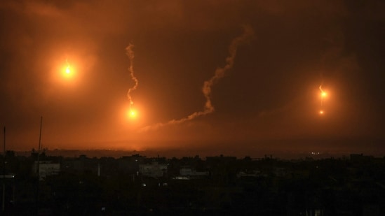 Israeli flares light the sky above Khan Yunis in the southern Gaza Strip as fighting resumed after the expiration of a seven-day truce between Israel and Hamas.