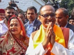 Bhopal: Madhya Pradesh Chief Minister Shivraj Singh Chouhan and wife Sadhna Singh greet BJP workers during counting of votes for MP Assembly elections,(PTI)