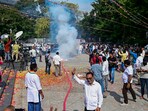 Congress workers burn firecrackers outside the party office to celebrate the party's lead during counting of votes for Telangana Assembly elections.