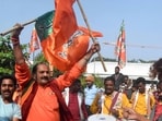 BJP workers celebrate the party's lead during counting of votes for MP Assembly elections.