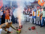  BJP workers and supporters celebrate the party's lead in Madhya Pradesh, Rajasthan and Chhattisgarh during counting of votes for the Assembly elections.(PTI)