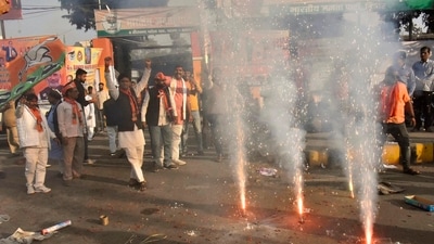 BJP workers and supporters celebrating the party's lead in Madhya Pradesh, Rajasthan and Chhattisgarh during counting of votes for the assembly elections. (Photo by Santosh Kumar / Hindustan Times) 
