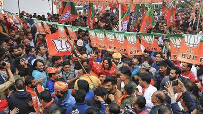 BJP supporters celebrate the party’s victory in the Rajasthan Assembly elections in Jaipur on Sunday. (PTI) BJP supporters celebrate the party’s victory in the Rajasthan Assembly elections in Jaipur on Sunday. (PTI)
