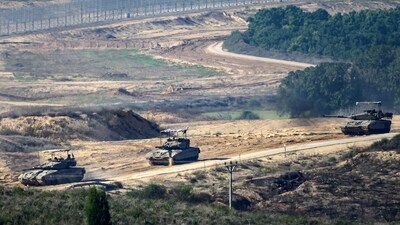 Israeli tanks maneuvring just outside the Palestinian enclave, during clashes between Israel and Hamas militants (AFP) Israeli tanks maneuvring just outside the Palestinian enclave, during clashes between Israel and Hamas militants (AFP)