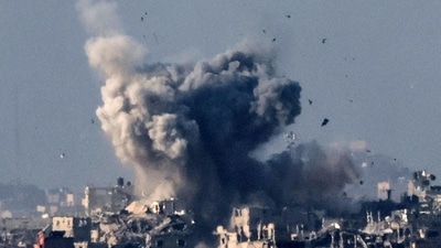 A picture taken from southern Israel near the border with the Gaza Strip on December 2, 2023, shows smoke billowing over the Palestinian territory during Israeli bombardment amid continuing battles between Israel and the militant group Hamas. Israel carried out deadly bombardments in Gaza for a second day on December 2 after a week-long truce with Hamas collapsed despite international calls for an extension. (Photo by JACK GUEZ / AFP) (AFP) A picture taken from southern Israel near the border with the Gaza Strip on December 2, 2023, shows smoke billowing over the Palestinian territory during Israeli bombardment amid continuing battles between Israel and the militant group Hamas. Israel carried out deadly bombardments in Gaza for a second day on December 2 after a week-long truce with Hamas collapsed despite international calls for an extension. (Photo by JACK GUEZ / AFP) (AFP)