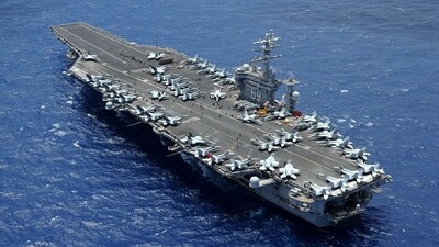 In this image released by the US Department of Defense, the aircraft carrier USS Dwight D. Eisenhower (CVN 69) is returning to homeport at Norfolk, Virginia after operating in the US 5th and 6th Fleet areas of responsibility in support of Operation Enduring Freedom on July 2, 2013. ABC News reported October 14 that Washington was sending the USS Eisenhower aircraft carrier strike group to support the USS Gerald R. Ford and its accompanying warships, which were already in the region. (Photo by Ryan D. McLearnon / US Department of Defense / AFP) / RESTRICTED TO EDITORIAL USE - MANDATORY CREDIT "AFP PHOTO / US Department of Defense/US Navy/Mass Communication Specialist 2nd Class Ryan D. McLearnon" - NO MARKETING NO ADVERTISING CAMPAIGNS - DISTRIBUTED AS A SERVICE TO CLIENTS (AFP) In this image released by the US Department of Defense, the aircraft carrier USS Dwight D. Eisenhower (CVN 69) is returning to homeport at Norfolk, Virginia after operating in the US 5th and 6th Fleet areas of responsibility in support of Operation Enduring Freedom on July 2, 2013. ABC News reported October 14 that Washington was sending the USS Eisenhower aircraft carrier strike group to support the USS Gerald R. Ford and its accompanying warships, which were already in the region. (Photo by Ryan D. McLearnon / US Department of Defense / AFP) / RESTRICTED TO EDITORIAL USE - MANDATORY CREDIT "AFP PHOTO / US Department of Defense/US Navy/Mass Communication Specialist 2nd Class Ryan D. McLearnon" - NO MARKETING NO ADVERTISING CAMPAIGNS - DISTRIBUTED AS A SERVICE TO CLIENTS (AFP)