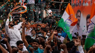 Congress workers celebrate early leads for their party in Telangana state elections in Hyderabad. (AP) Congress workers celebrate early leads for their party in Telangana state elections in Hyderabad. (AP)
