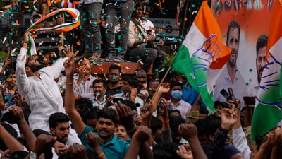 Congress workers celebrate early leads for their party in Telangana state elections in Hyderabad. (AP) Congress workers celebrate early leads for their party in Telangana state elections in Hyderabad. (AP)