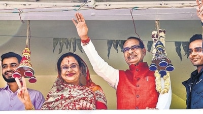 Madhya Pradesh chief minister Shivraj Singh Chouhan celebrates the BJP’s victory, with his family in Bhopal on Sunday. (PTI) Madhya Pradesh chief minister Shivraj Singh Chouhan celebrates the BJP’s victory, with his family in Bhopal on Sunday. (PTI)