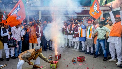 BJP workers and supporters celebrate the party's lead in Madhya Pradesh, Rajasthan and Chhattisgarh during counting of votes for the Assembly elections. (PTI) BJP workers and supporters celebrate the party's lead in Madhya Pradesh, Rajasthan and Chhattisgarh during counting of votes for the Assembly elections. (PTI)